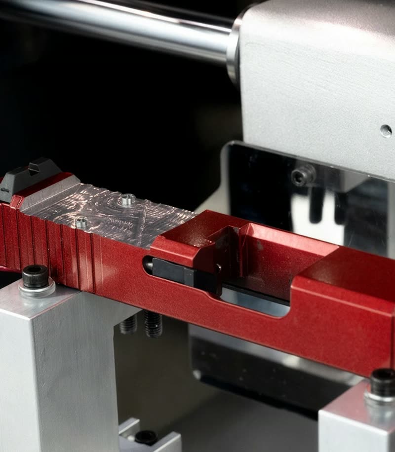 Pistol slide fixtured for optic cutting